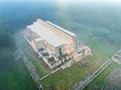 Aerial view of the ancient ruins of Kabah surrounded by mystical fog and lush greenery, Santa Elena, Mexico.