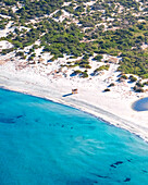 Aerial drone view of a rescue brigade hut on Plage de l'Ostriconi, Mediterranean beach during summer, island of Corsica, France.