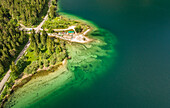 Aerial view of small sport grounds on Lago del Predil lake, Italy.