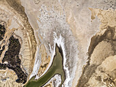 Aerial view of mudflats and salt flats along the shoreline at Accident Inlet, Gulf of Carpentaria, Karumba, Queensland, Australia.