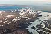 Aerial view of steam ascending from hot lava slowly flowing into the river Jokulsa a Fjollum during volcanic eruption of Holuhraun in September 2014, highlands of Iceland