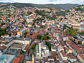Aerial view of the historic Bascarsija and Gazi Husrev-beg Mosque amidst scenic rooftops and mountains, Sarajevo, Bosnia and Herzegovina.