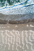 Abstract aerial top view of sand lines created by the wind and waves at the North Sea beach near Slufter valley, Texel, Noord-Holland, Netherlands.