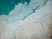 Aerial view of beach with algae accumulation and turquoise water, Pula, Croatia.