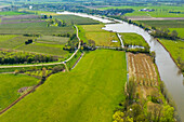 Aerial view of river Linge, fruit orchards and farmland, Rhenoy, Betuwe, Gelderland, Netherlands.