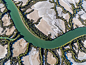 Aerial view of winding river and desert vegetation in Accident Inlet, Gulf of Carpentaria, Karumba, Queensland, Australia.