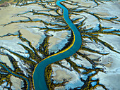 Aerial view of winding river flowing through Accident Inlet, Gulf of Carpentaria, Karumba, Queensland, Australia.