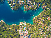 BRAC ISLAND, CROATIA - AUGUST 2014: Aerial view of resort and houses on the Adriatic coast.