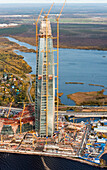 Aerial view of the beautiful Lakhta Center skyscraper amidst urban development and scenic waterfront, Saint Petersburg, Russia.