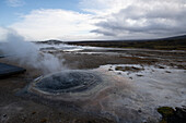 Aerial view of a Geyser in a hot spring in Southern Region, Iceland.