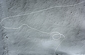 Aerial view of serene snowy landscape with abstract patterns and smooth textures, Chuvash Republic, Russia.