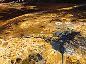 Aerial view of a volcanic hot spring with sulphuric smoke, Namafjall Hverir viewpoint, Northeastern Region, Iceland.