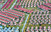 Aerial view of organized suburban neighborhood with beautiful rooftops and urban layout, Saint Petersburg, Russia.
