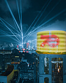 Aerial view of Shanghai cityscape at night during the 70th anniversary with the sky tower illuminated, Shanghai, China.
