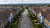 Aerial view of beautiful residential houses and tree-lined streets in a suburban neighborhood, Exeter, United Kingdom.