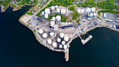 Aerial view of industrial plant and storage tanks by the pier, Karlshamn Citadel, Sweden.
