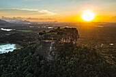 Aerial view of sunrise over the famous Sigiriya Rock Fortress called Lion Rock, Sri Lanka.