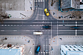 Aerial view of fast blurry cars traffic moving across crossroad in Kaunas city, Lithuania.