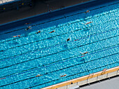 Aerial view of public pools with swimmers enjoying the water, Westend, Berlin, Germany.