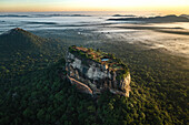 Aerial view of sunrise over the famous Sigiriya Rock Fortress called Lion Rock, Sri Lanka.