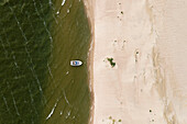 Aerial view of speedboat floating near sand dune in Curonian spit, Lithuania.