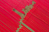 Aerial view of people working with red cloth drying lines at textile factory, Narsingdi, Bangladesh.