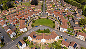 Aerial view of residential circle pattern with homes and green spaces, Exeter, United Kingdom.