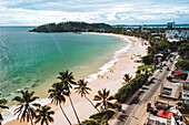 Aerial view of sunny Mirissa beach in day time, Sri Lanka.