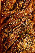 Babka with black garlic, cheese and roasted spring onions