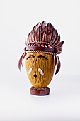 Artistic chocolate Easter egg with feather headdress