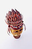 Artistic chocolate Easter egg with feather headdress