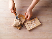 Cut the speculoos out of the moulds with a knife