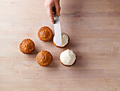 Smooth the topping on the muffins with a palette knife in a dome shape