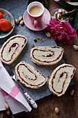 Cake roulade with pistachio cream and jam