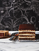 Opera cake made from almond sponge, coffee, rum and buttercream