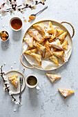 Puff pastry triangles with apricot filling