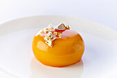 Calisson (French almond confectionery) with gold leaf and almonds