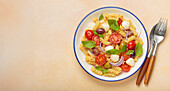 Italian fusilli salad with olives, cherry tomatoes and mozzarella