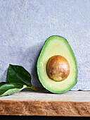 Halved avocado with pit