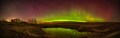 A panorama of the aurora of April 17, 2025 to the north here and reflected in the irrigation pond at home in Alberta. The aurora shows the classic green arc as well as magenta and red upper curtains. This night brought an arc of proton aurora before this. Jupiter and the Pleiades are setting over my house at left.