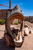 A T. rex head for taking souvenir photos of a person inside its mouth. Moab Giants Dinosaur Park near Moab, Utah.