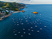 Aerial view of th boats moored near the coast of Tossa de Mar, Girona, Spain
