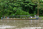 Students board the boat to take them home after school on the Napo River in the Amazon Basin of Ecuador.