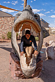 A T. rex head for taking souvenir photos of a person inside its mouth. Moab Giants Dinosaur Park near Moab, Utah.