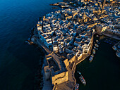 Aerial view of Porto Antico, the historic old port, the Marina, Castello Carlo V and the old town, Monopoli, Italy
