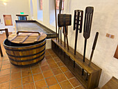 Wooden vats & implements in the old brewery in the Convent of San Francisco, now a museum in Quito, Ecuador.
