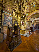 An ornately-carved wooden confessional in the Church of the Society of Jesus in Quito, Ecuador.