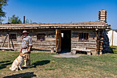 A man in period dress at the reconstructed replica of old Fort Bridger in the Fort Bridger Historic Site in Wyoming.