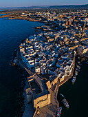 Aerial view of Porto Antico, the historic old port, the Marina, Castello Carlo V and the old town, Monopoli, Italy
