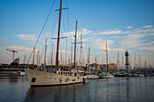 Sailing boats at sunset in Barcelona Port Vell Marina, Barcelona, Spain